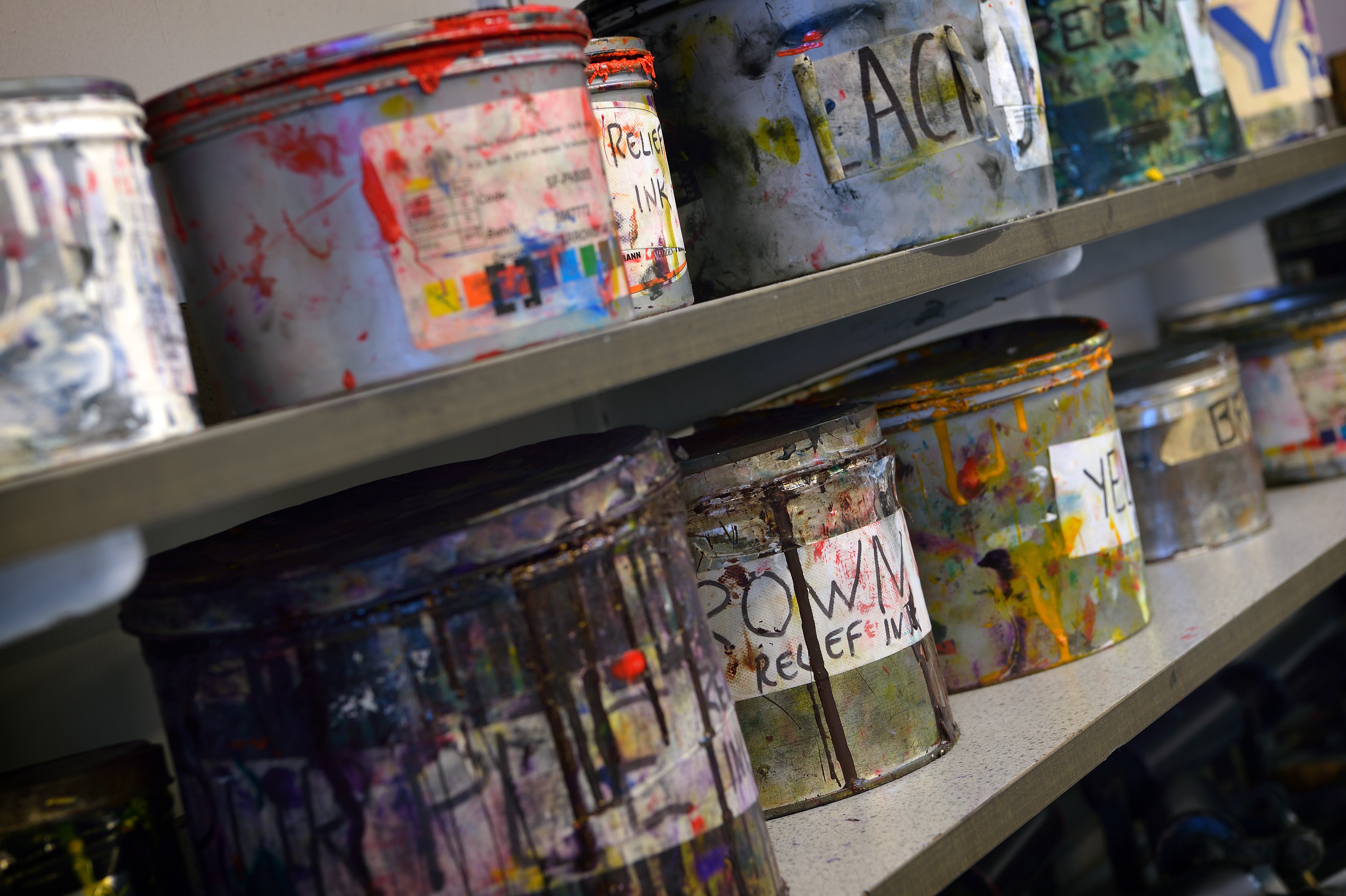 Fine print ink tins on a shelf, University of Bolton