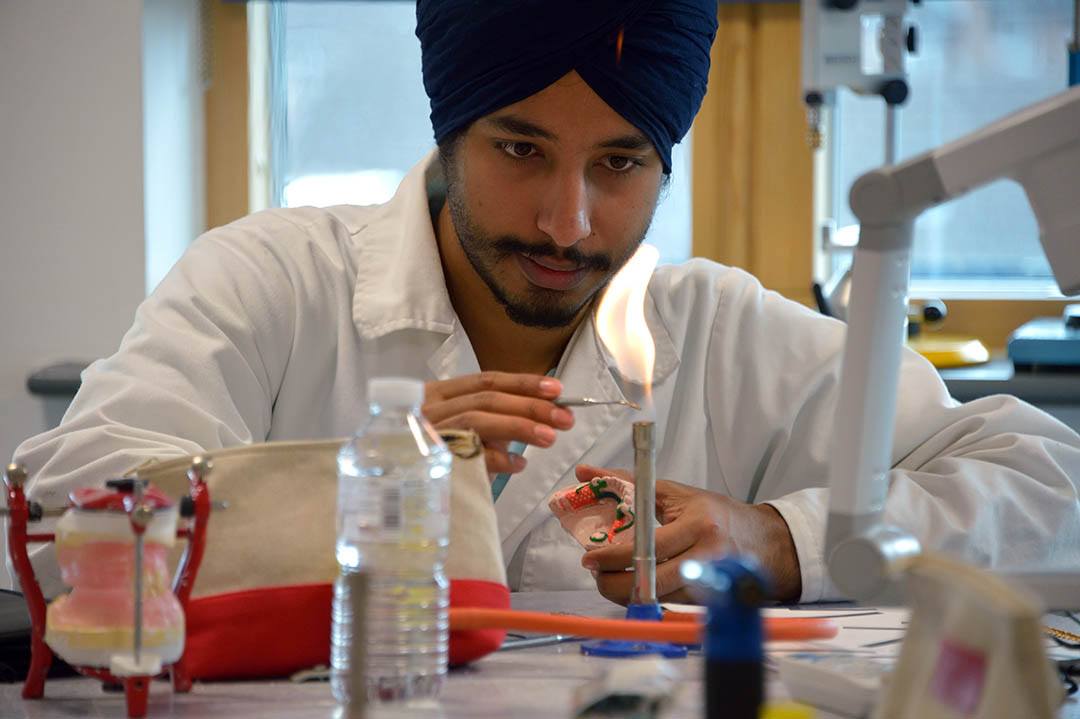Student using a Bunsen burner