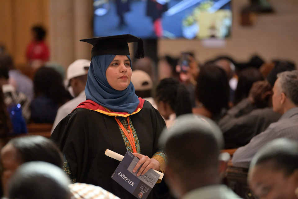 University of Greater Manchester research students celebrate their success with grand graduation at Bolton Parish Church